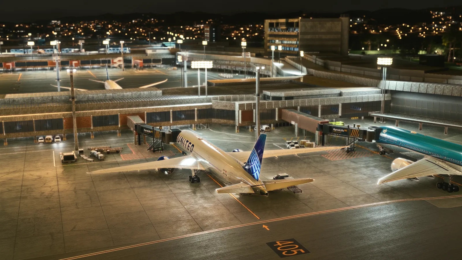 Night view of a terminal with a United 787 and another widebody at ApronLife jet bridges showing the ApronLife ad.